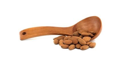 Wooden spoon with almonds isolated on white background