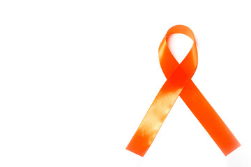 orange ribbon with negative space as a symbol of leukemia awareness