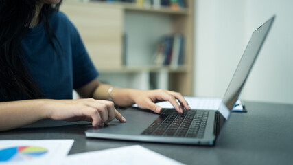 busineswomen using computure to working on tax document and paying tax.