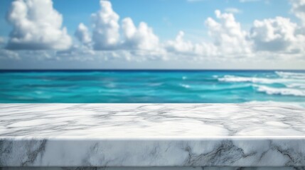 Fototapeta premium White marble table top set against a blurred ocean vista and blue sky ideal for showcasing or composing product displays High quality image