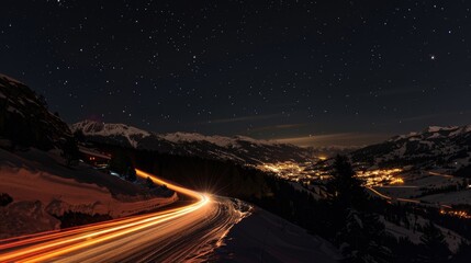 The stars above are outshined by the radiant light trails of cars making their way towards the ski resort up ahead.