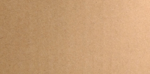 Craft brown paper texture surface macro close up view. Cardboard sheet texture background, pattern of brown kraft paper with vintage style.