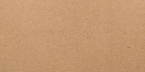 Craft brown paper texture surface macro close up view. Cardboard sheet texture background, pattern of brown kraft paper with vintage style.