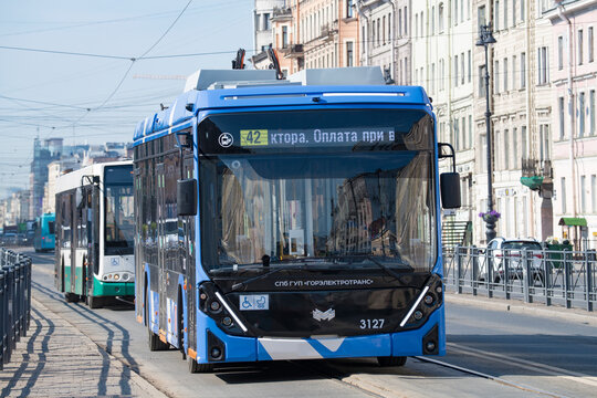 SAINT PETERSBURG, RUSSIA - JUNE 27, 2023: Trolleybus BKM 32100D "Olgerd" with increased autonomous speed on the route on a sunny June day