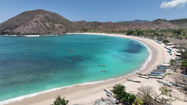 Dreamy tropical island beach clear turquoise ocean tranquil travel video Mawun Beach Lombok Indonesia aerial drone footage 4k mavic 3