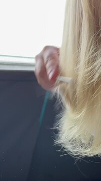 Hair breaks when combing woman combing not gentle treatment of hair bad care falling out cut ends of hair split 