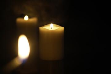 Close-up of Lit Candles in the Dark for Tranquility, Meditation, and Serenity