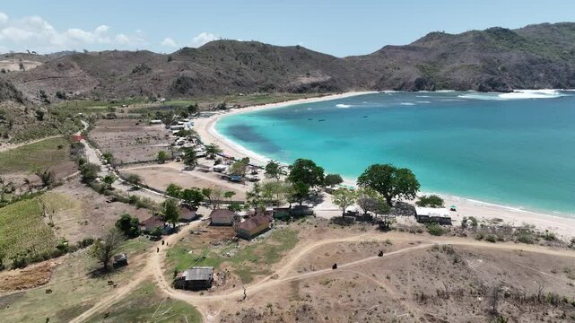 Dreamy tropical island beach clear turquoise ocean tranquil travel video Mawun Beach Lombok Indonesia aerial drone footage 4k mavic 3