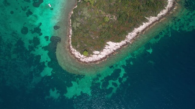 Uvala Otočić Mala Kneža Island Is Surrounded By Turquoise Water In Racisce, Croatia. Aerial Topdown Shot