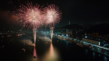 Spectacular Fireworks Display Over Water at Night