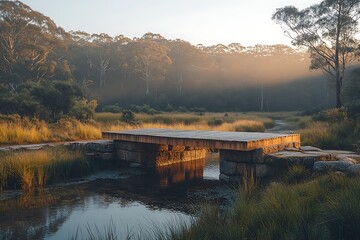 A wooden bridge crosses a calm river at sunset, surrounded by a lush forest.