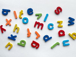 Colorful wooden letters on white background