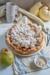 pear crumble cake in a baking form 