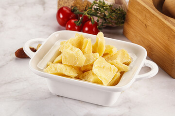 Crushed parmesan cheese in the bowl