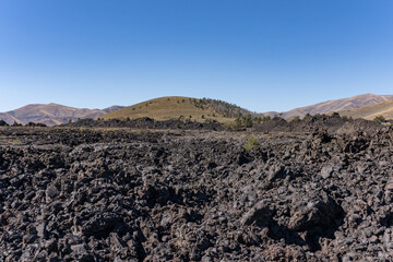 Aa lava flow. Big Craters Slab Lava Flow. North Crater Flow Trail / Craters of the Moon National Monument & Preserve. Volcanic Field. Idaho's eastern Snake River Plain.

