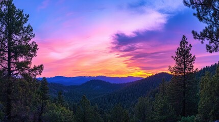 Obraz premium Panoramic view of a Sierra Nevada sunset with vibrant colors, set against a backdrop of a lush pine forest, capturing the essence of nature and wildlife, with space for text.