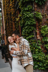Fototapeta premium A romantic couple is embracing and smiling in a closeup moment of love
