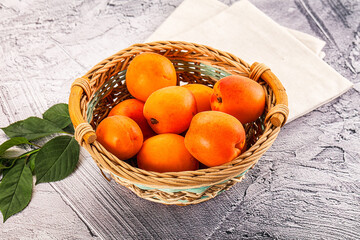 Raw ripe sweet apricots heap