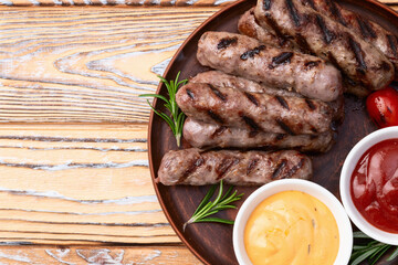 Grilled beef sausages with rosemary sauce and tomatoes photography . Top view