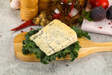 Blue cheese piece over board