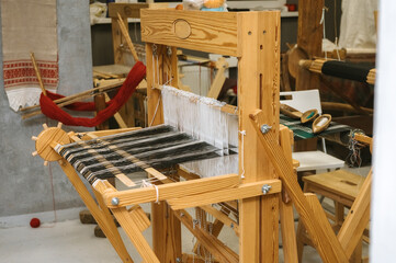 Distaff Day Traditional weaving loom in artisan workshop for textile crafting and design