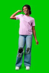 Joyful woman celebrating success with clenched fists against a bright green background