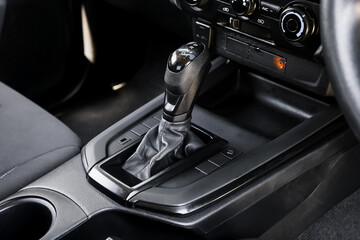 automatic transmission shift selector in the car interior. Closeup a manual shift of modern car gear shifter. 4x4 gear shift