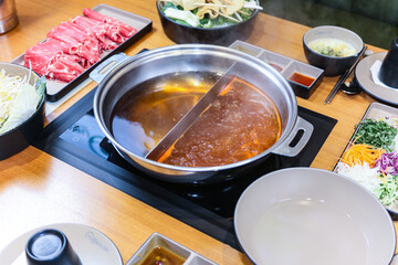 Korean style Shabu Shabu. Two types of broth. Mild and spicy taste