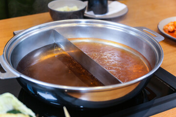 Korean style Shabu Shabu. Two types of broth. Mild and spicy taste