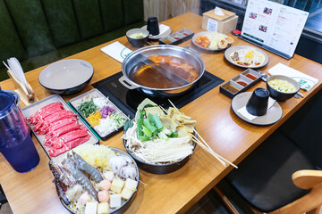 Korean style Shabu Shabu. Two types of broth. Mild and spicy taste
