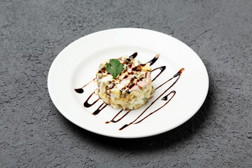 Olivier salad. On a gray background. Photo for the menu.