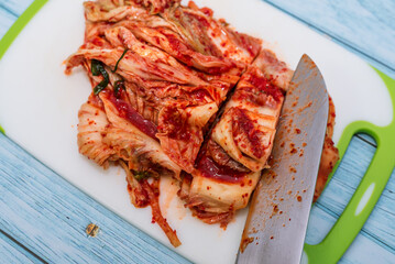 Traditional Korean Kimchi on Cutting Board with Knife