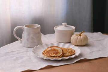 Experience a Cozy Autumn Breakfast Featuring Delicious Pancakes and Inviting Decor