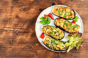Baked eggplant with pieces meat.