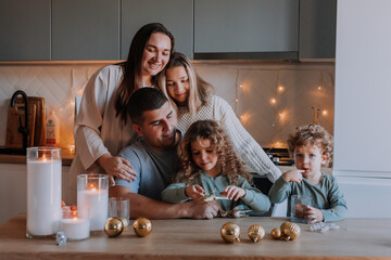 Fototapeta premium happy large family has breakfast in the kitchen on Christmas Day