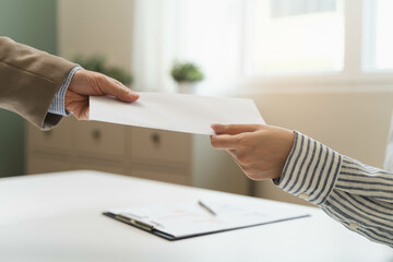 female employee smiling when she receive salary from boss.