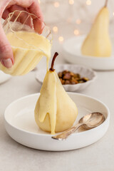 Poached pears with vanilla sauce