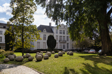 View of the public garden and the 18th century exterior facade of the old town hall in Aalst, East Flanders, Belgium, the garden is also a venue for wedding ceremonies.