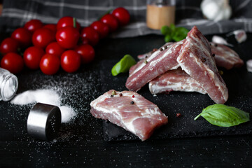 Fresh raw pork ribs. With spices. on a wooden background