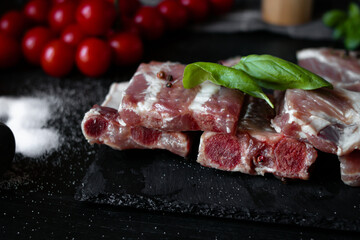 Fresh raw pork ribs. With spices. on a wooden background