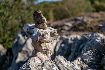 A pyramid of stones in the mountains in close-up.