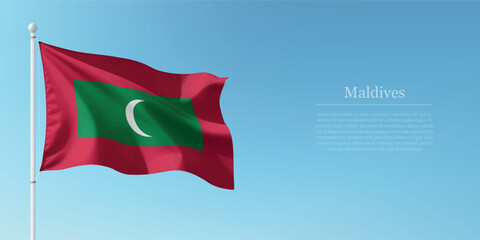 Waving Flag of Maldives Against Clear Blue Sky Copyspace