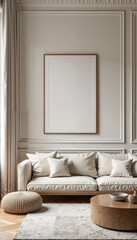 A large picture frame with a blank canvas hangs on a white wall with decorative molding in a luxurious living room with a white sofa, ottoman, and round coffee table.