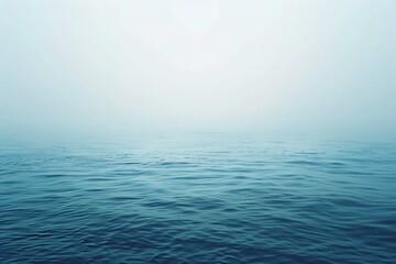 Obraz premium Foggy Water. Calm Blue Ocean Landscape with Hazy Sky Background