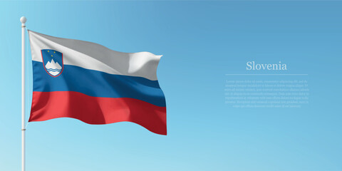 Waving Flag of Slovenia Against Clear Blue Sky Copyspace
