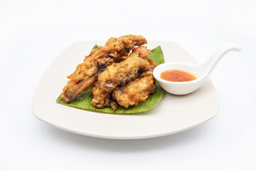 Fried chicken on white plate with white background, asia food, unhealthy food