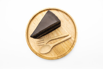 Slice of Chocolate Cake on the wooden plate isolate white background