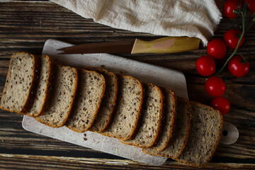 
Freshly baked bread with grains. on a wooden background. baking