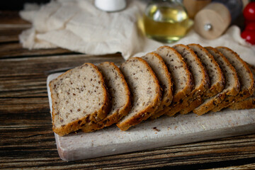 
Freshly baked bread with grains. on a wooden background. baking