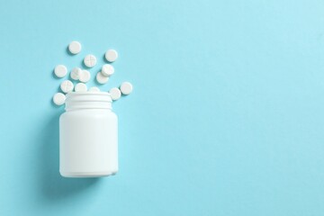 Various medicine pills on color background